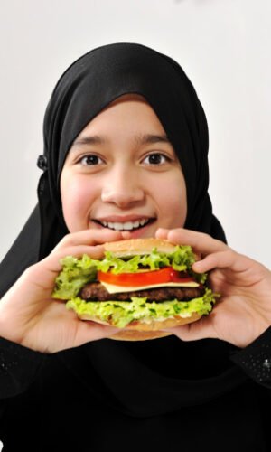 Arabic girl eating burger